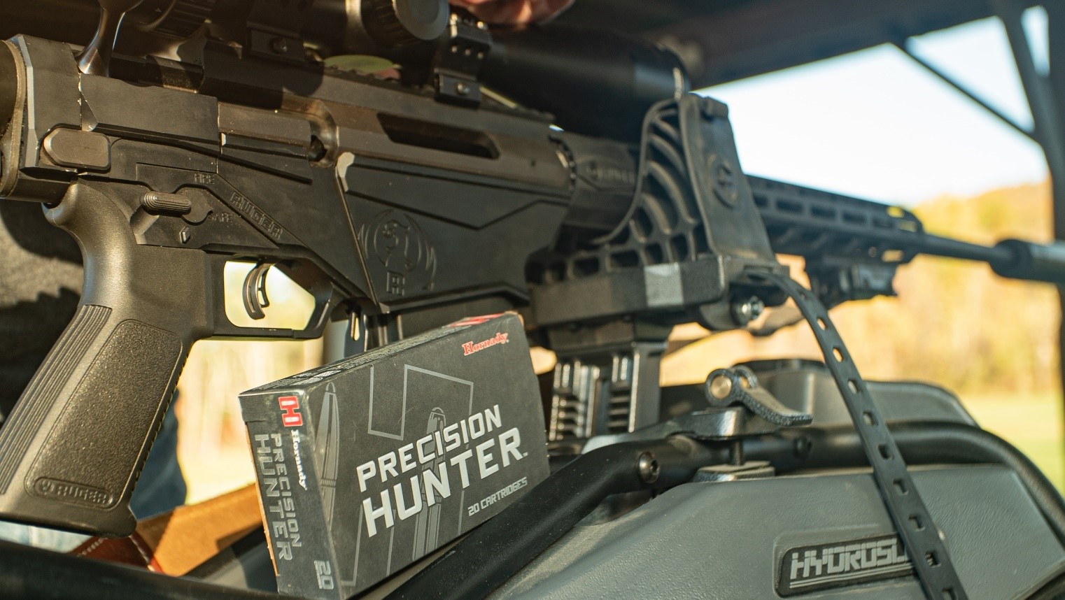 rifle with a box of ammo